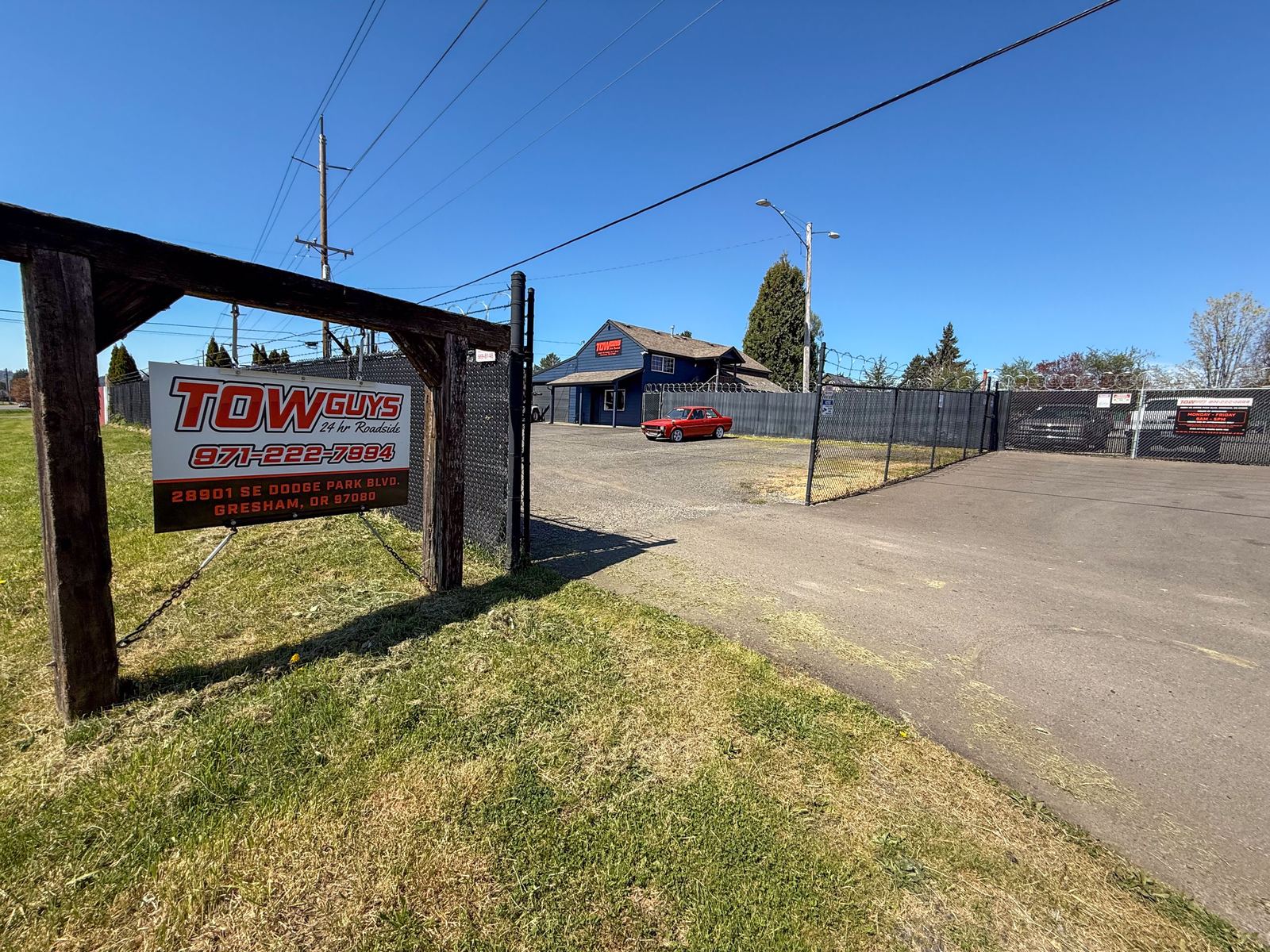 Tow Guys secure impound yard and sign on SE Dodge Park Blvd in Gresham